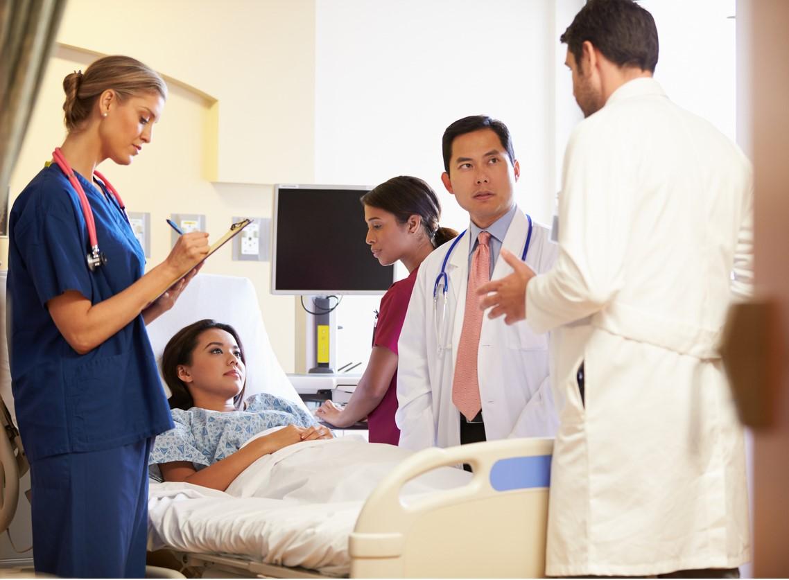 Medical team at hospital bed