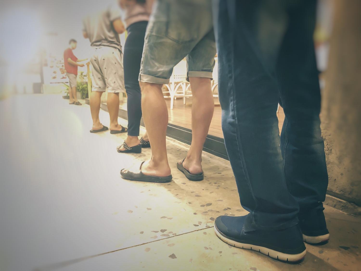 Men waiting in line