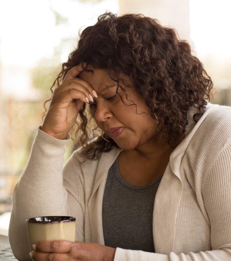 Middle-aged woman looking sad