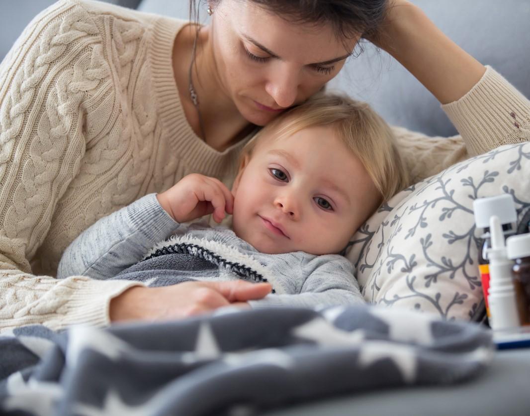 Mom in bed with sick kid