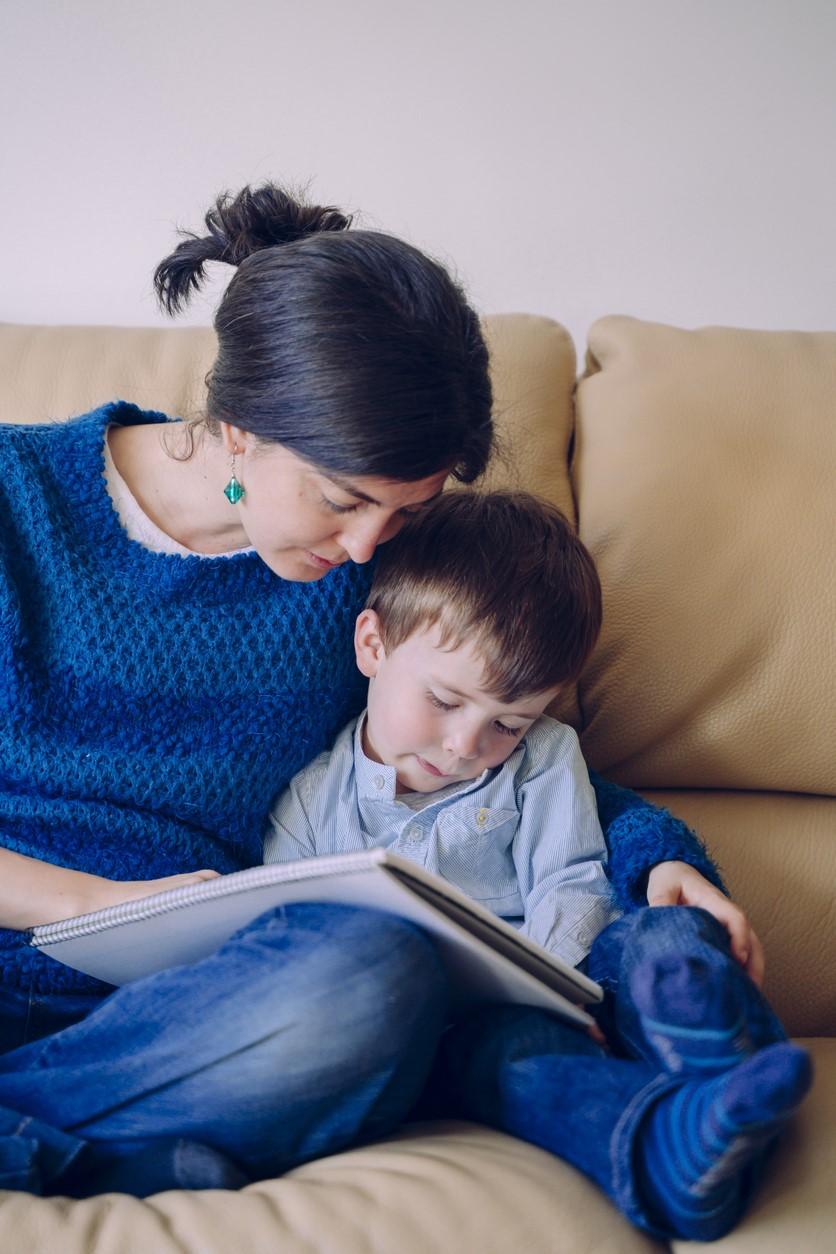 Mother reading to sick boy