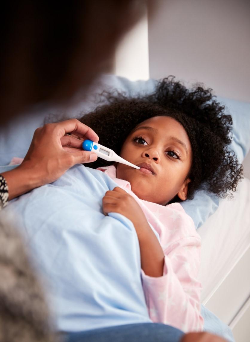 Mom taking child's temperature