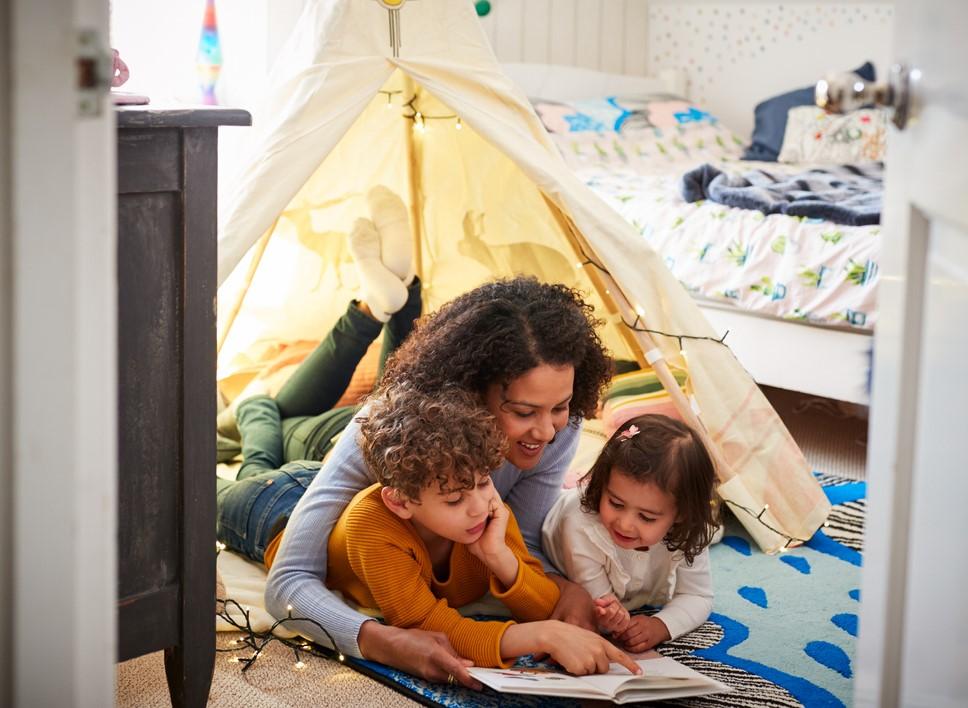 Mom with kids in bedroom tent