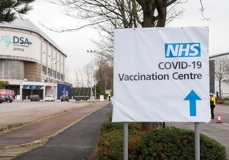 COVID vaccine center sign in England
