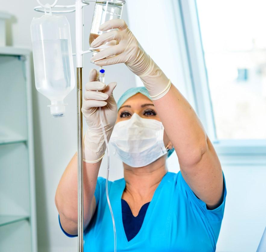 Nurse with IV stand