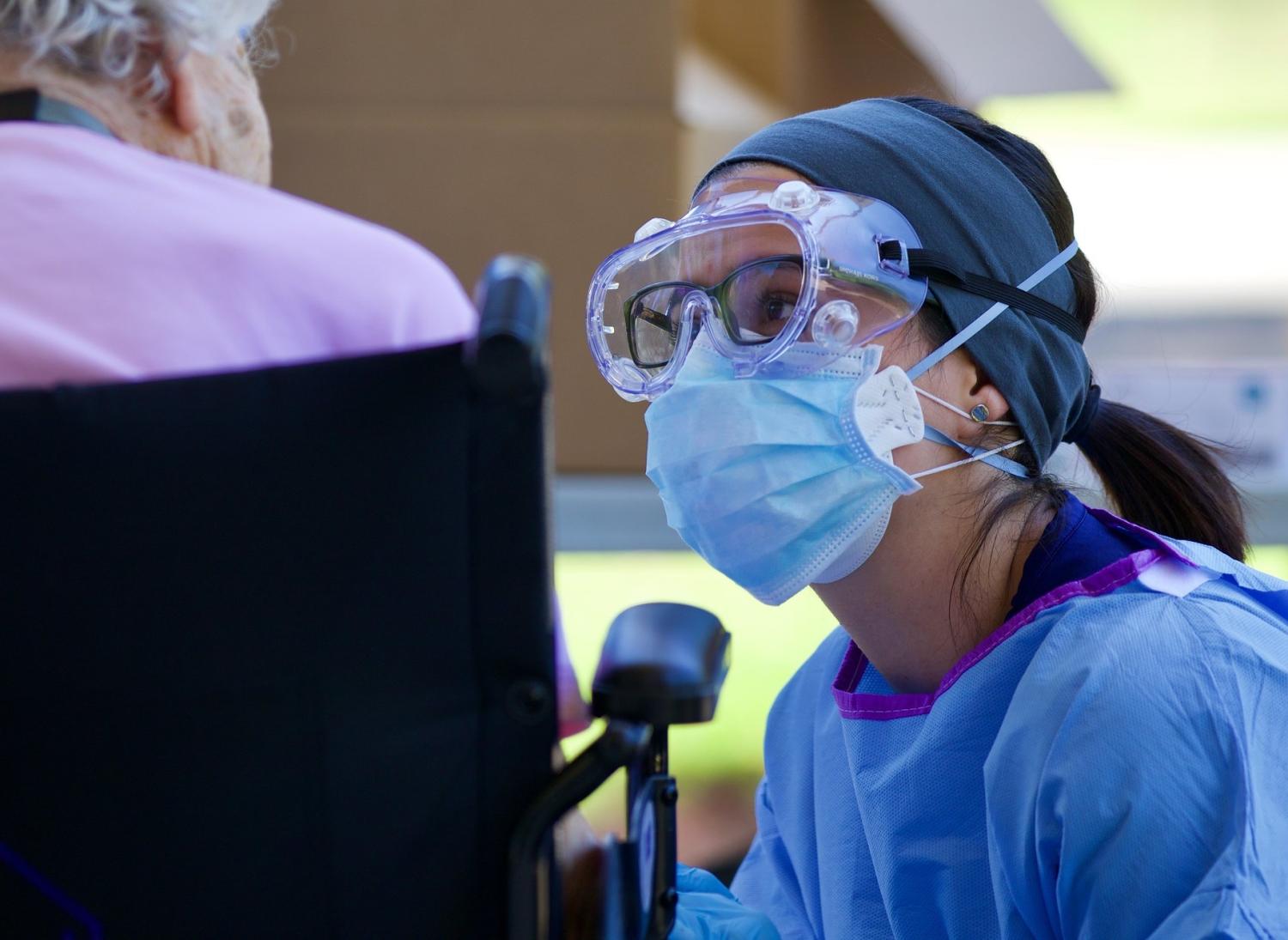 Nurse with elderly woman in wheelchair