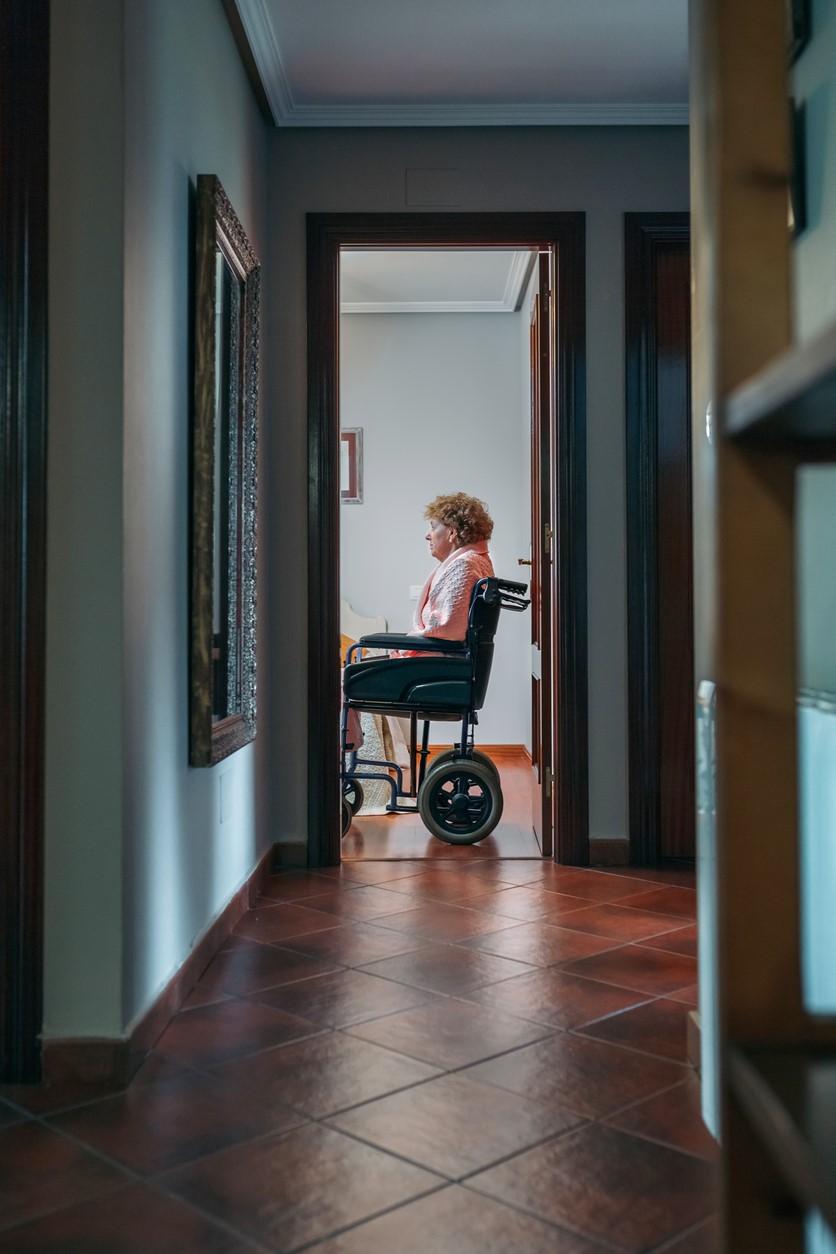 Nursing home resident alone in wheelchair