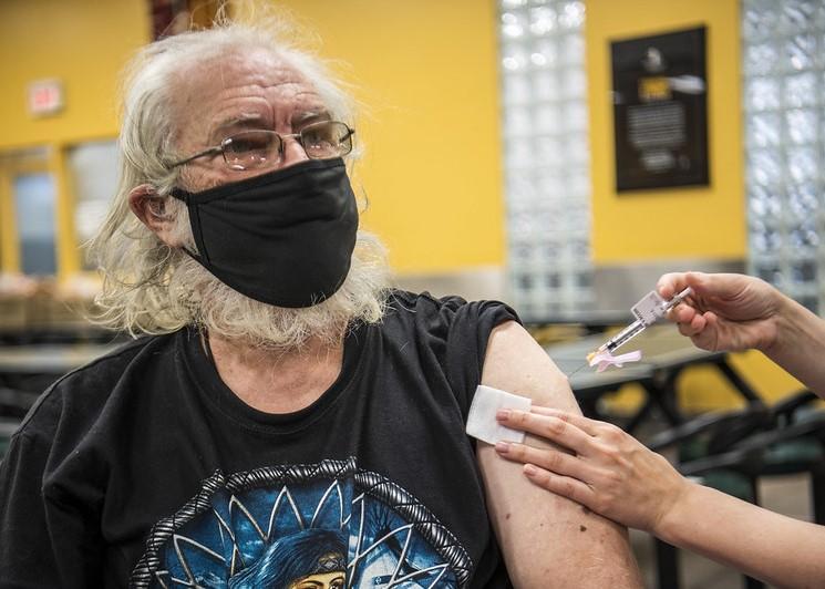 Older man getting COVID vaccine