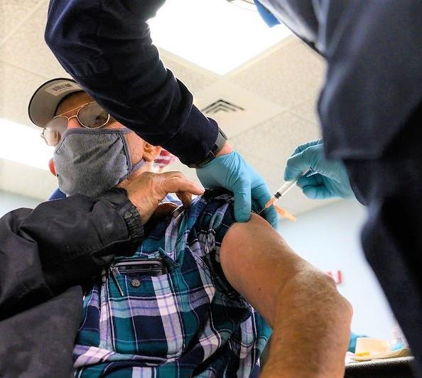Elderly man getting COVID vaccine