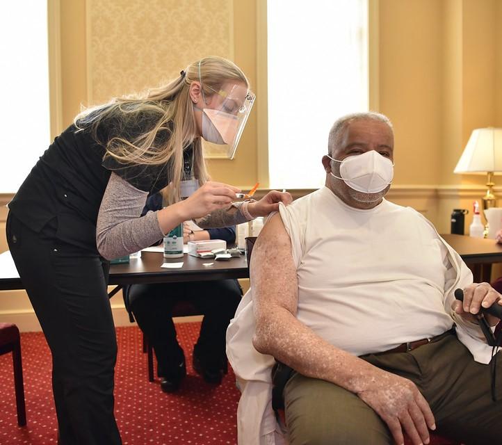 Older man getting COVID vaccine