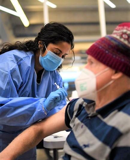 Older man getting vaccinated