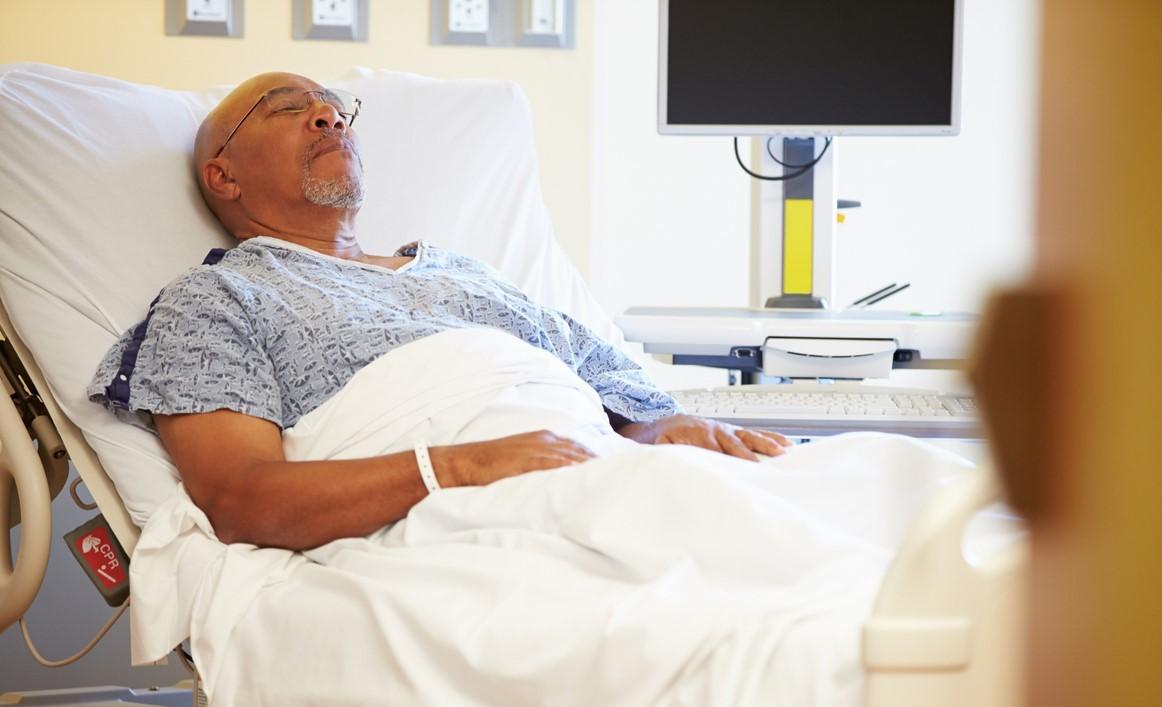 Older man in hospital bed