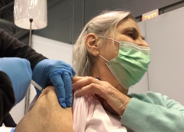 Older woman getting COVID shot