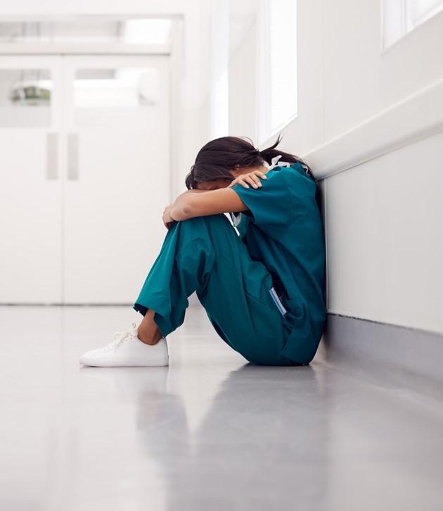 Overworked doc in hallway