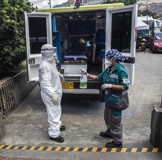 Paramedic getting sanitizer sprayed