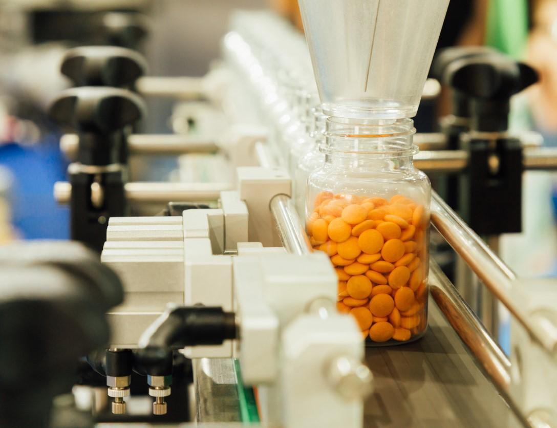 Pill bottles on assembly line