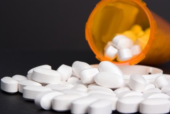 Pills spilling from bottle