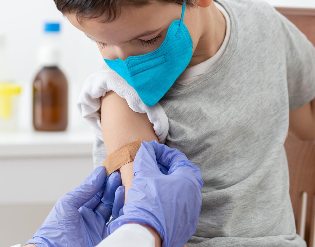 Post-vaccine bandage for young boy
