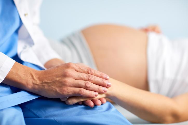 Pregnant woman and doctor