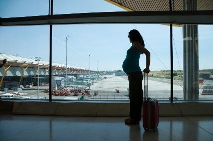 Pregnant woman at airport