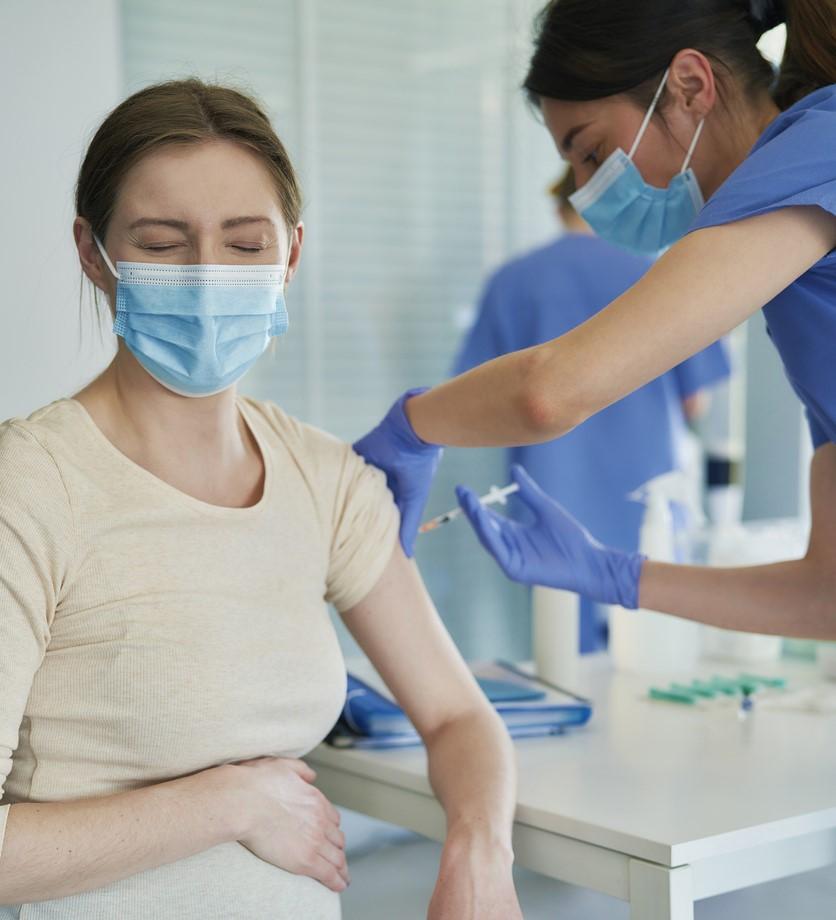 Pregnant woman getting vaccinated
