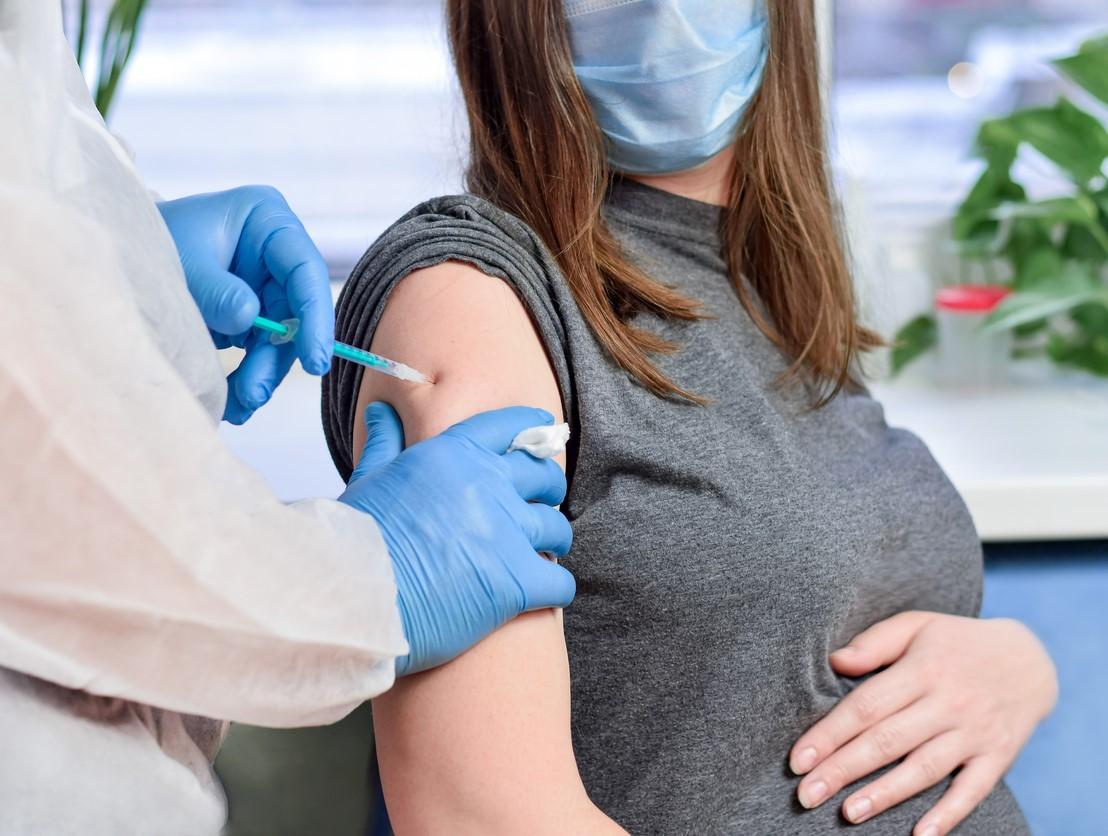 Pregnant woman getting vaccinated