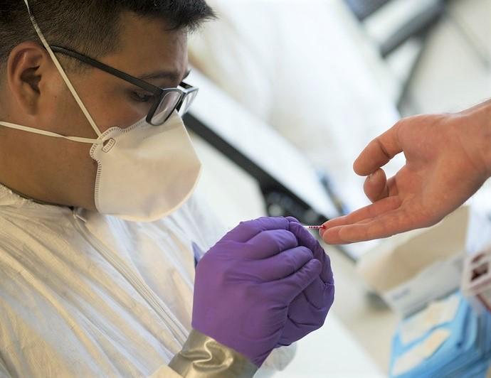 Finger prick for rapid COVID testing