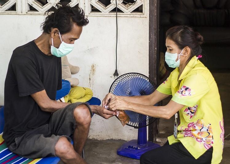 Man receiving tuberculosis drugs