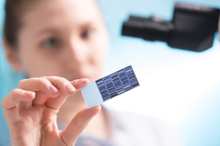 Scientist holding DNA sequence
