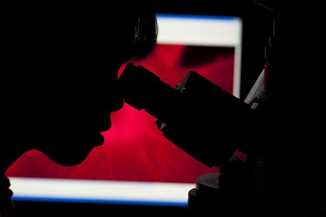 Scientist with microscope