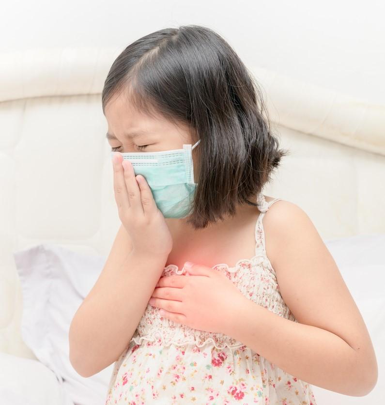 Sick Asian girl with medical mask