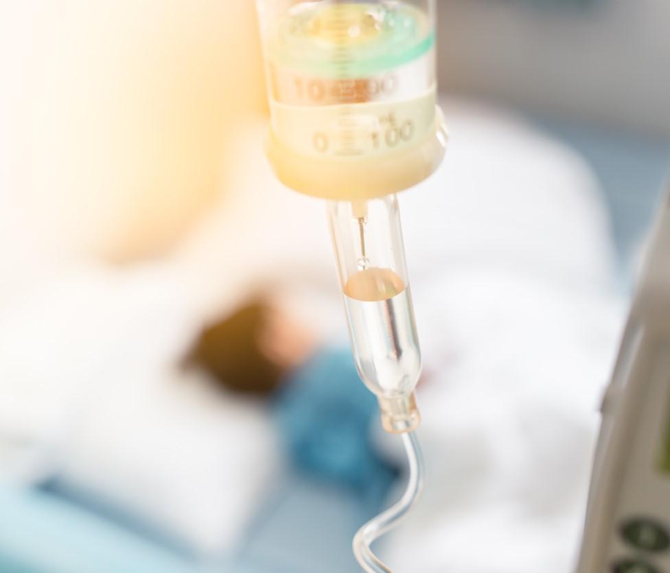 Sick child hooked up to IV fluids