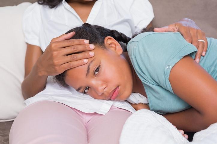 Sick daughter on mom's lap