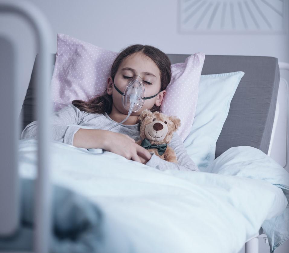 Sick girl on oxygen in hospital