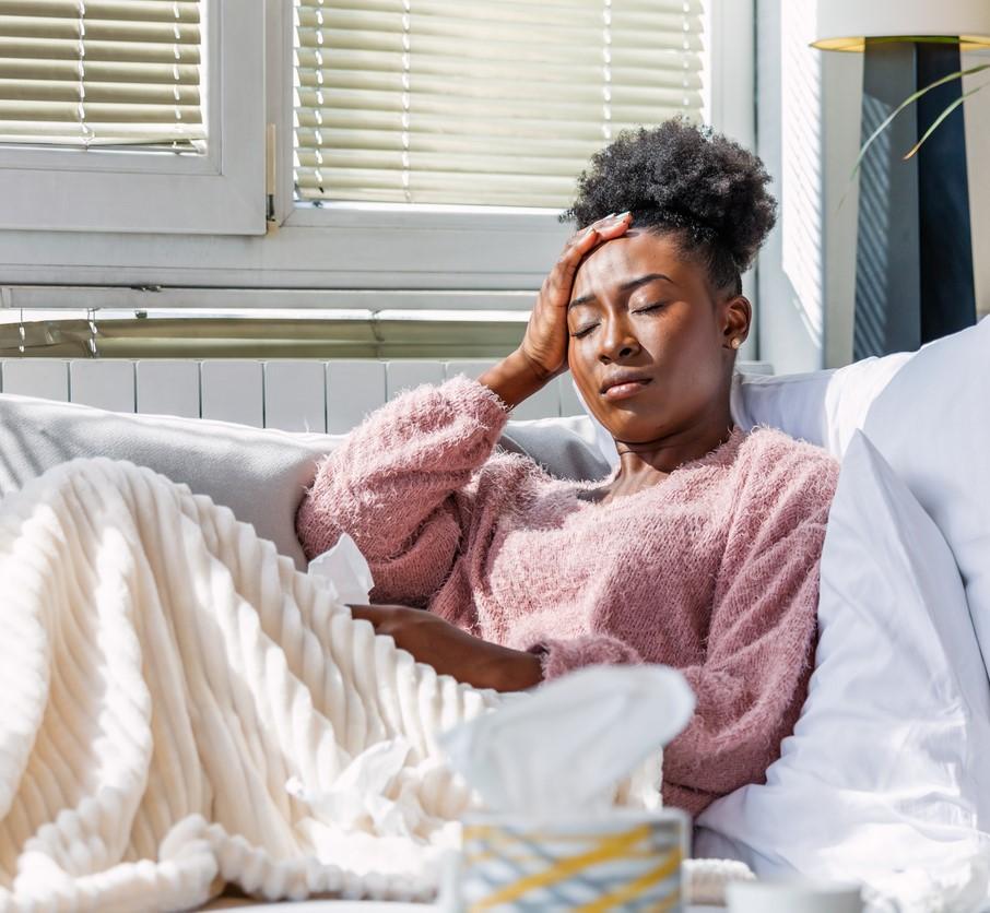 Sick woman on couch