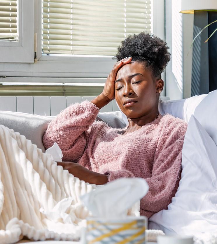 Sick woman on couch