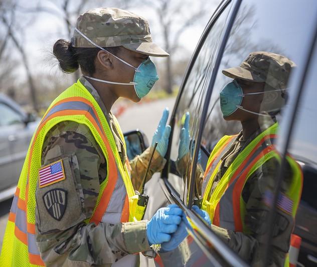 Soldier wearing N95 at car window