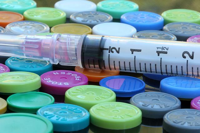 Syringe on vials