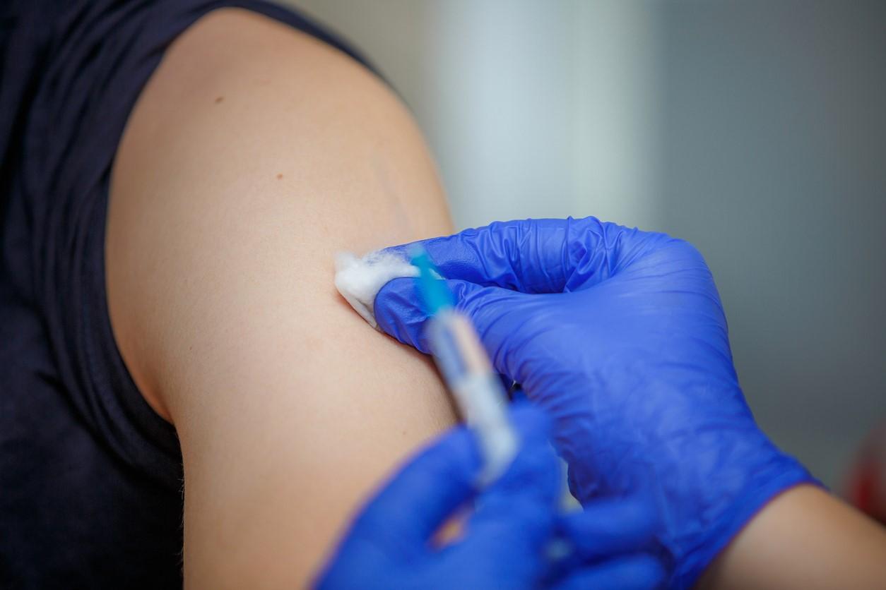 Syringe with needle and biceps