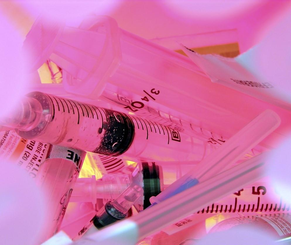 Syringes in sharps container
