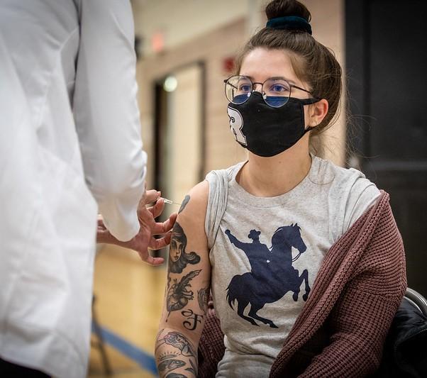 Teen getting COVID vaccine