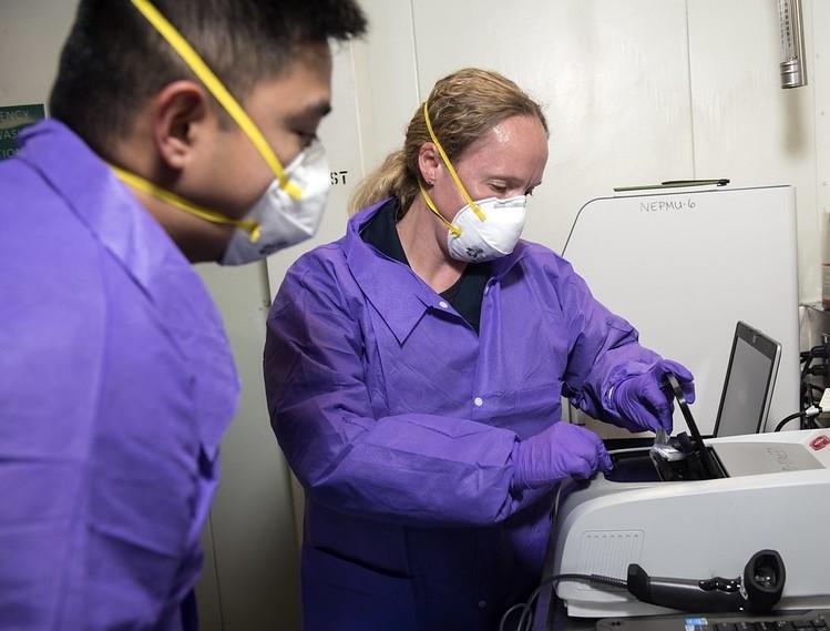 Health workers testing for pathogens