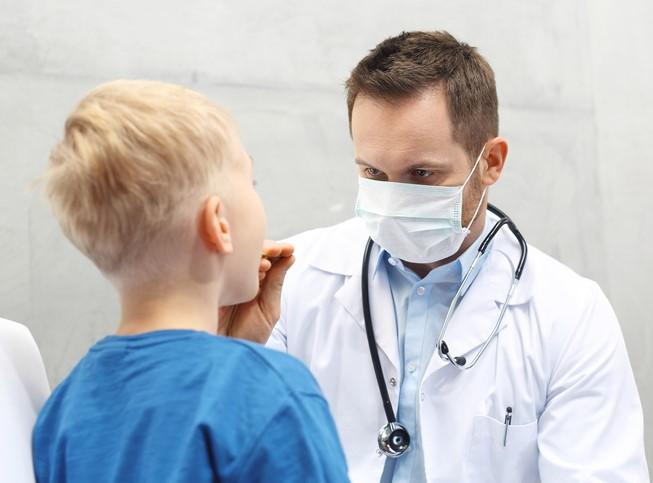Throat exam of young boy