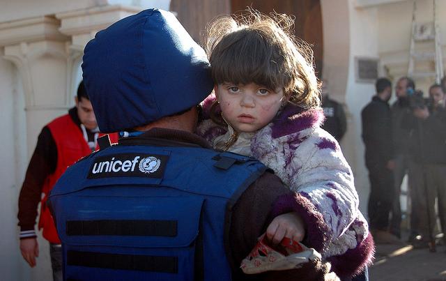 UNICEF worker and child