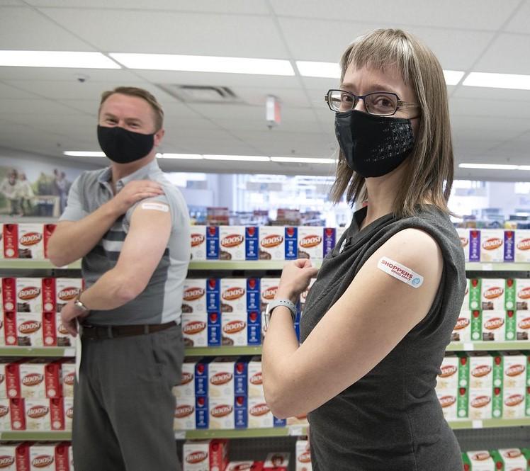Band-aids on arms after vaccination