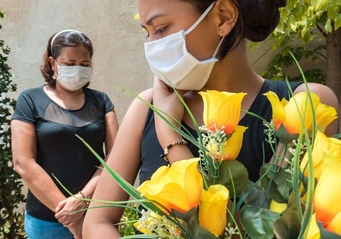 Wearing masks at funeral