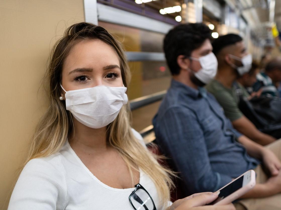 People wearing masks on a train