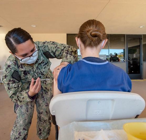 woman getting COVID vax
