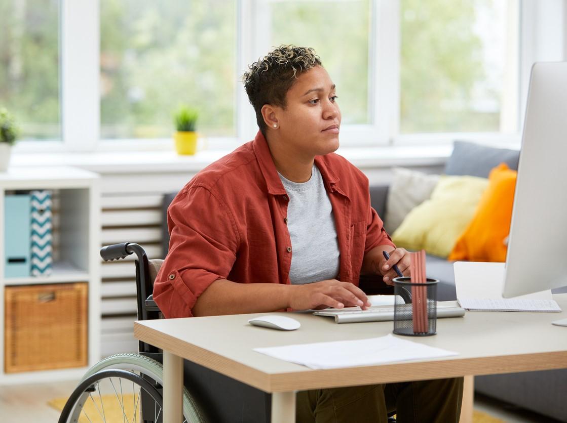 Woman in wheelchair at computer