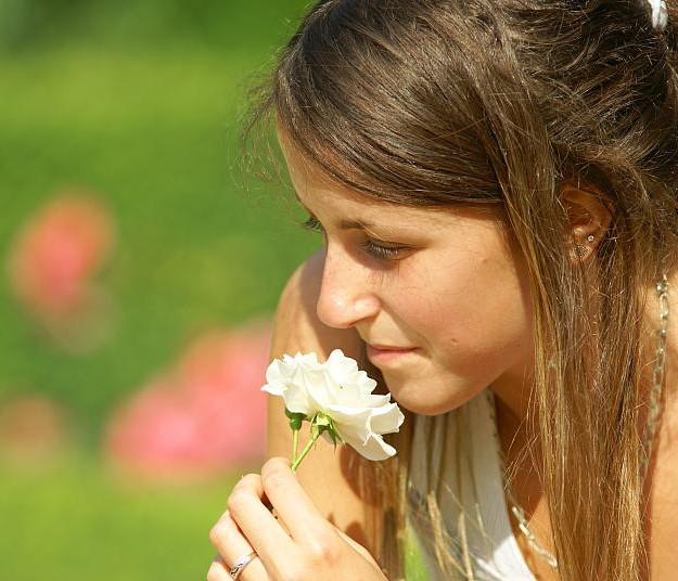 Woman smelling roses